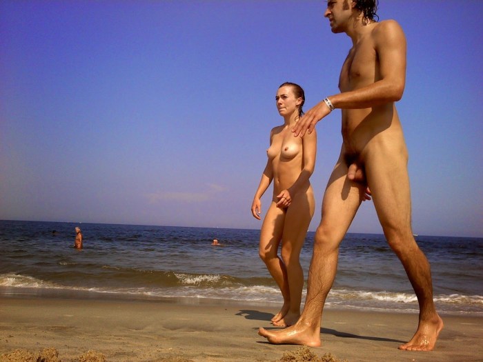 Naked men and women on the beach
