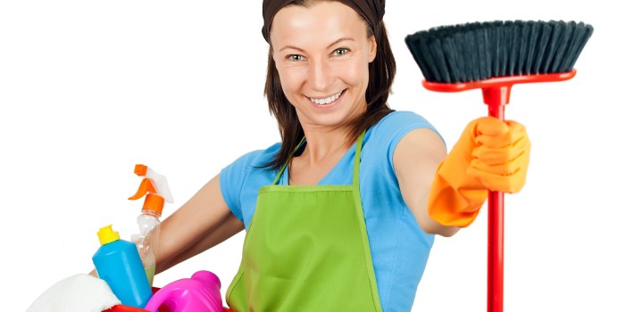 The woman washes the floor