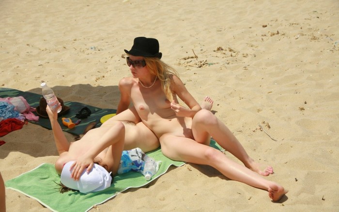Drunk naked women on the beach