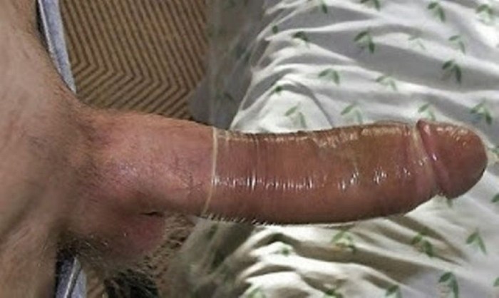 A man cums in a condom