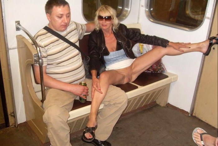 A girl on an escalator without panties