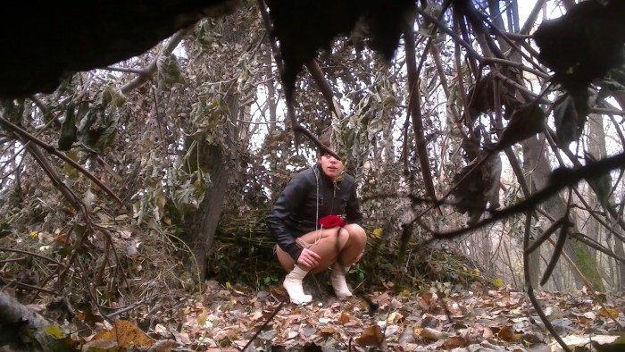 Female pissing in nature
