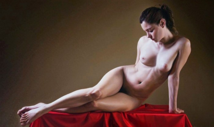 Naked women pose an artist