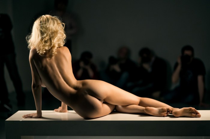 Poses for an erotic photo shoot