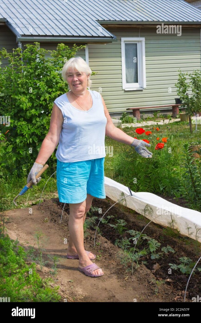 Elderly woman in the country house