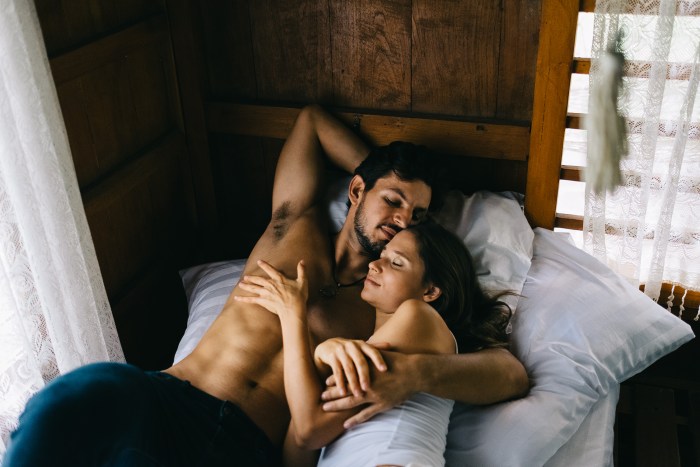 Girl with a guy in the bed