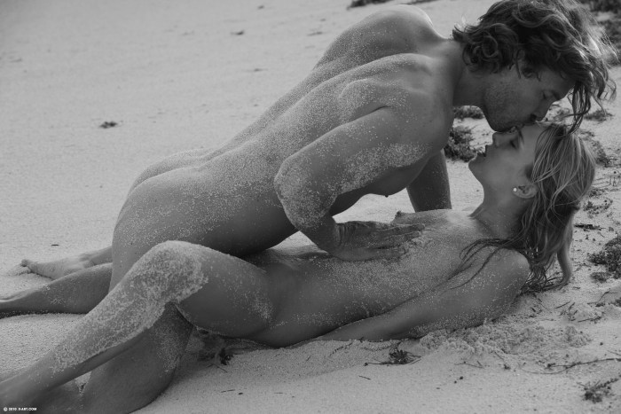 Naked girls on the beach with a racer