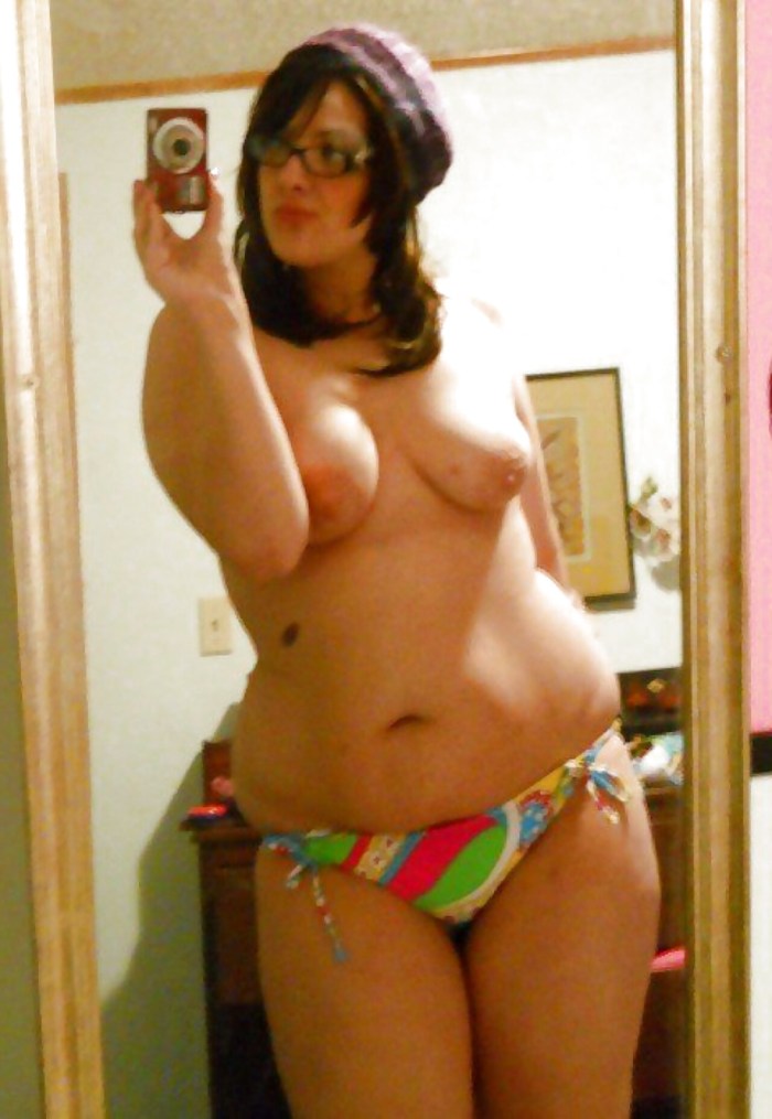 Lush boobs in front of the mirror
