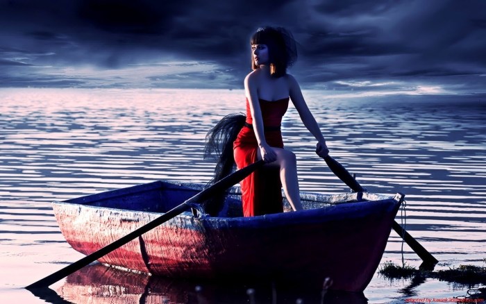 The girl is floating in a boat