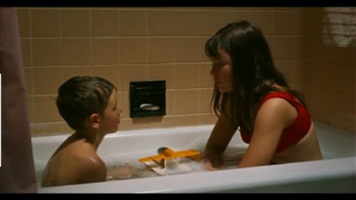 Boy washes in the film