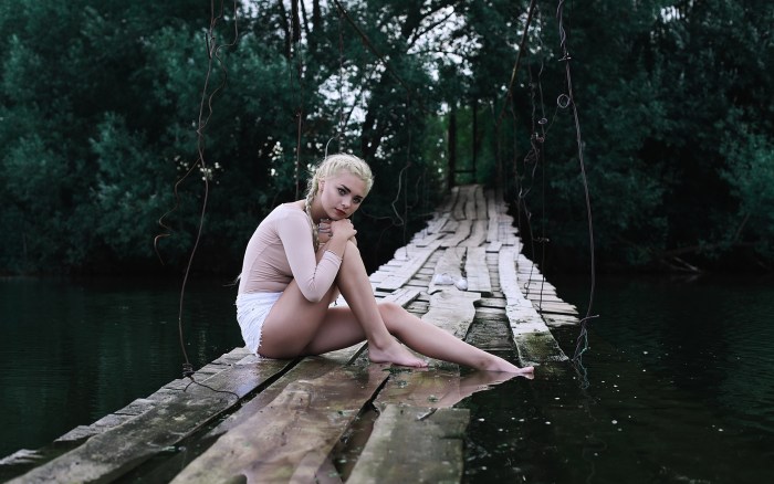 Girl on a village pond