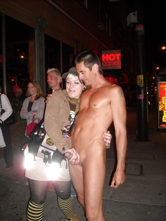 The girl undresses in front of the man
