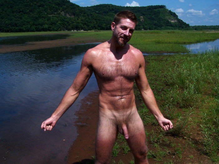 Naked guy pissing on the beach