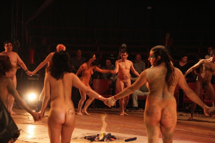 Naked actors on the stage of the theater