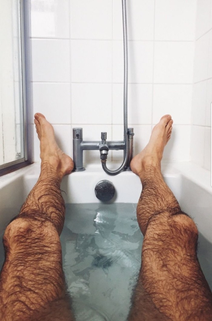 Men's legs in the shower