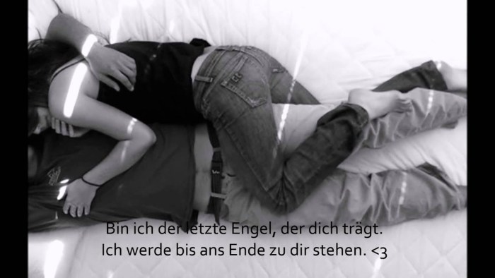 The guy and the girl are lying on the bed