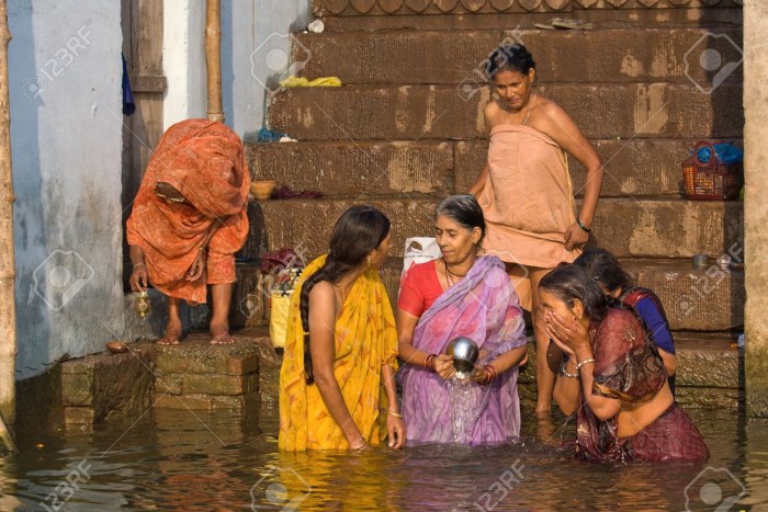 Women in India wash on the street