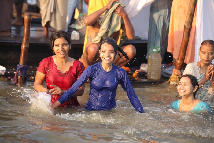 Indian women bathe