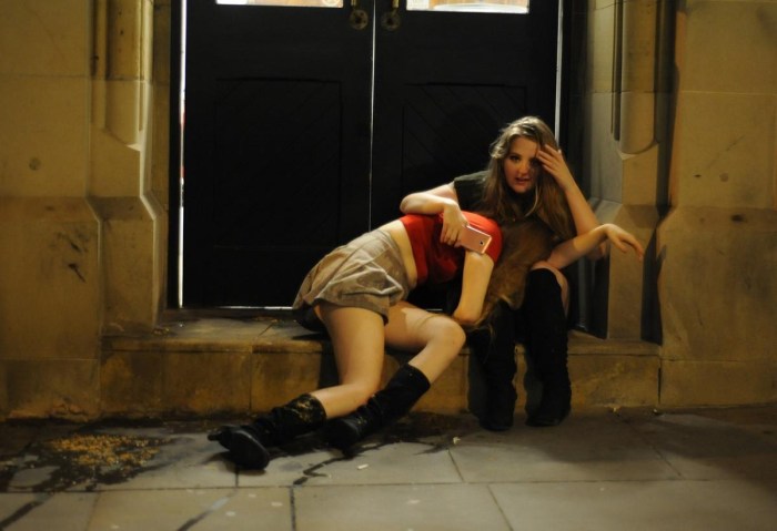 Drunk woman lying on the street