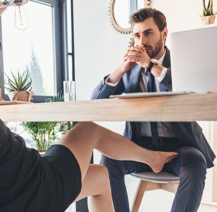 Foot on the table under the table
