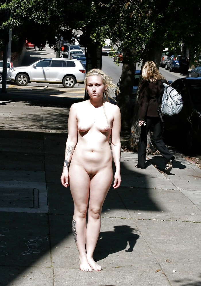 Naked woman walks along the street
