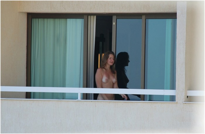 Naked on the balcony spied