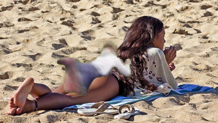 Young girls sunbathe