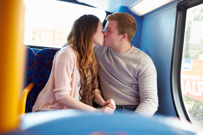 On the bus pestering his wife