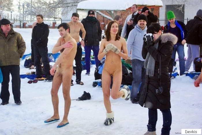 Naked men bathed in an ice hole