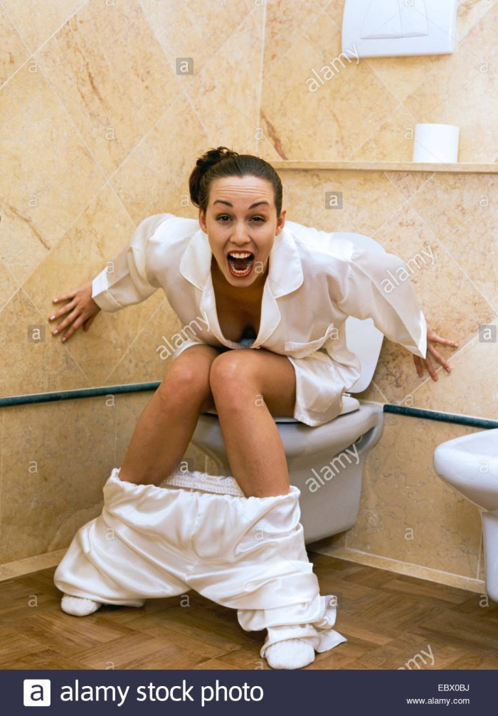 Peeing girls on the toilet