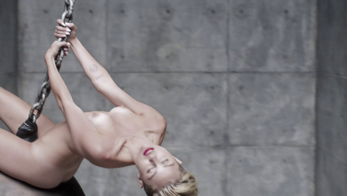 Miley Cyrus suction on stage
