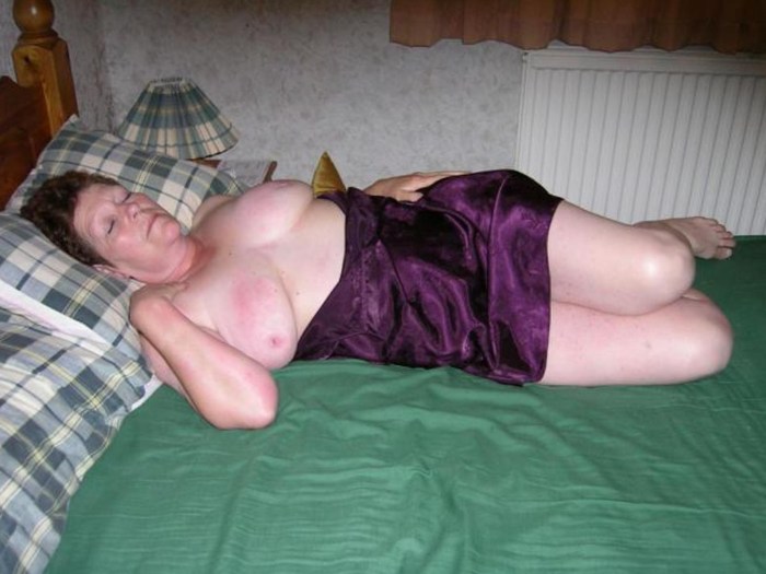 Old woman in bed boobs