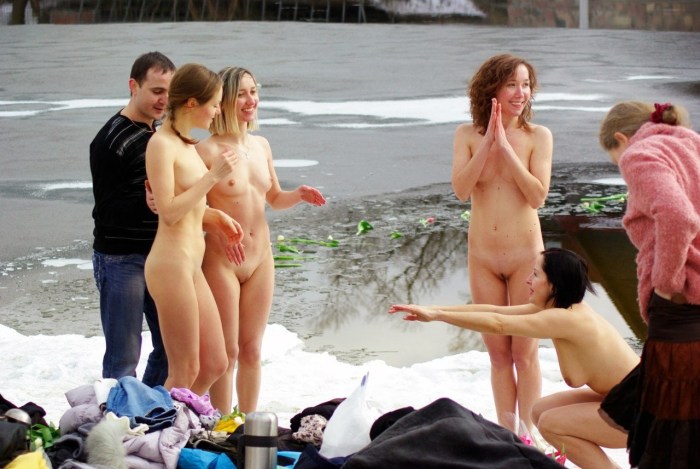 Naked mature women in an ice hole