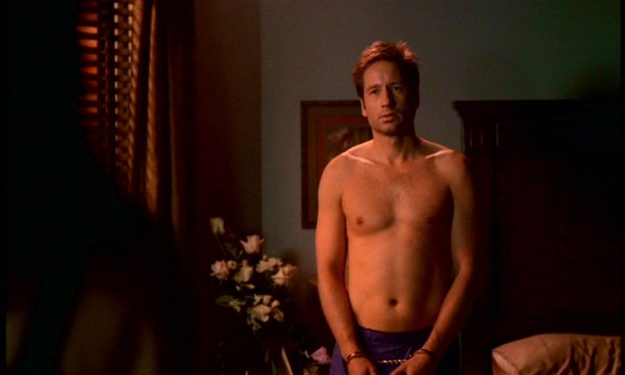 David Dudins in red swimming trunks