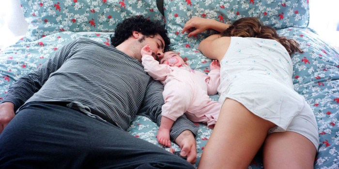 Girl with a guy and child sleeping