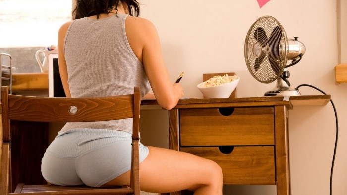 Naked woman sitting in a chair