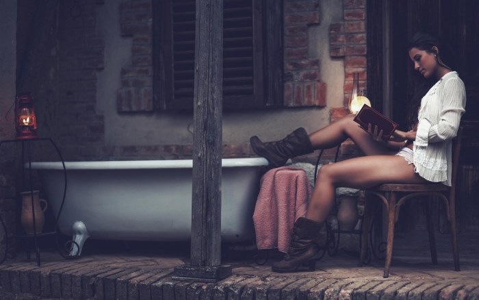 Girls are sitting on a veranda