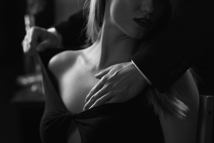 The man unfastens the dress