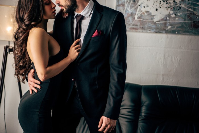 The girl takes off his jacket