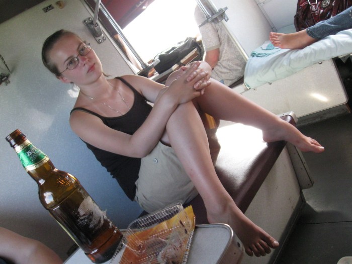 The girl sleeps on the train