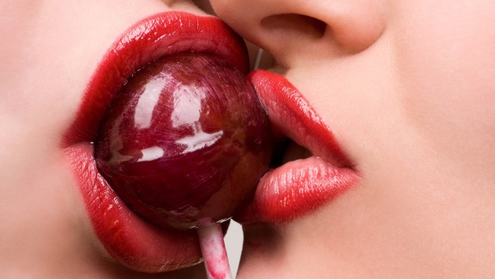 Female lips with a tongue