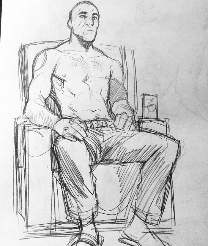 A person sits in a reference chair