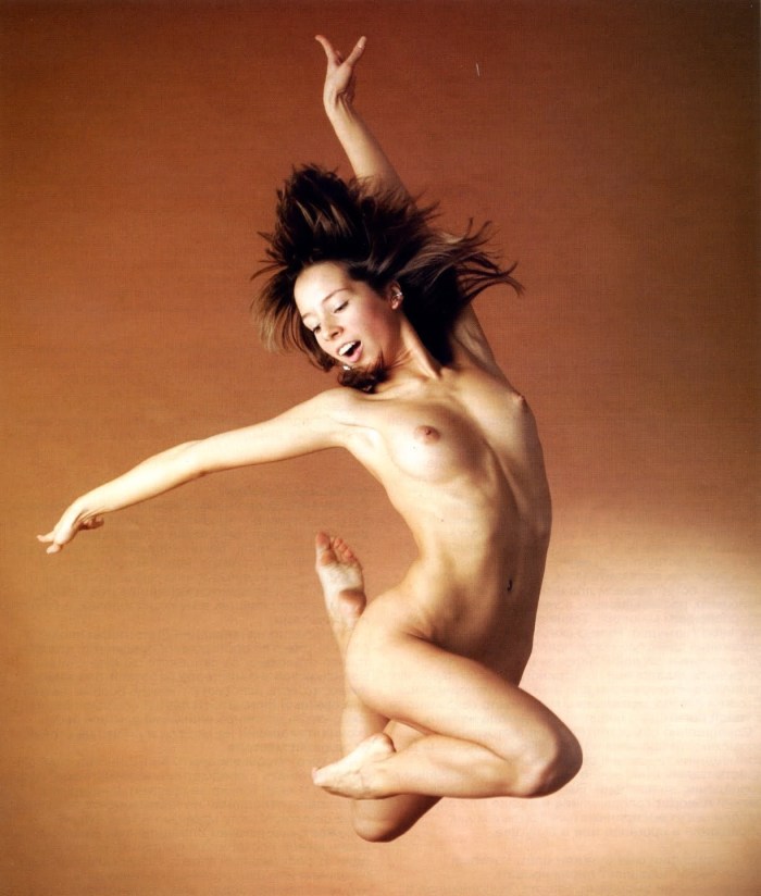 A naked woman bounces