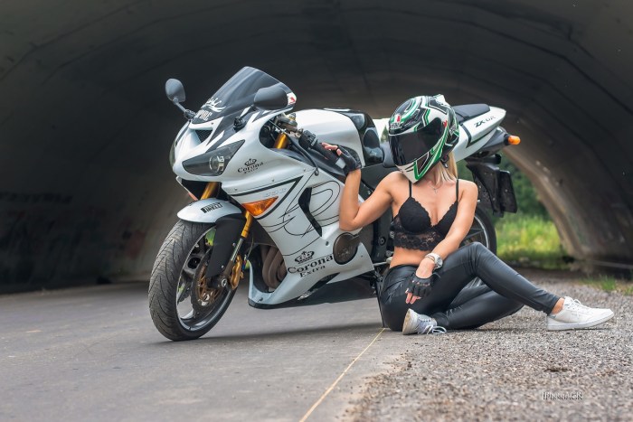 A guy with a girl on a motorcycle