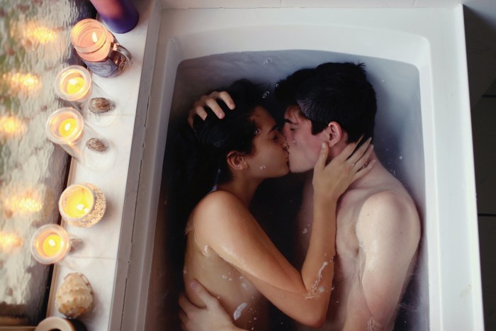 A guy with a girl in a bath