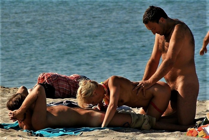 Joint masturbation on the beach