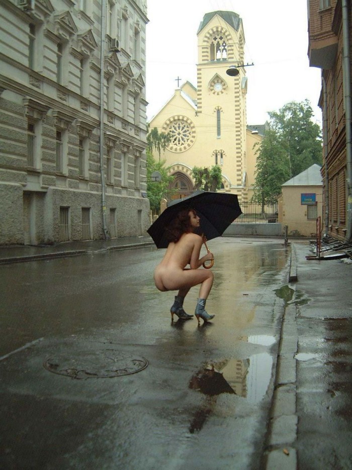 Naked beauties in the rain