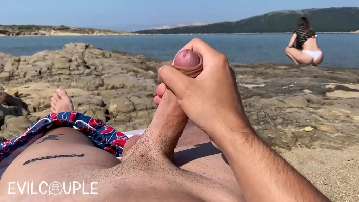 Naked men and women on the beach
