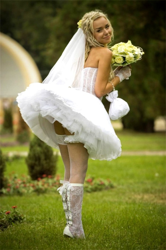 Brides in wedding dresses under the dress