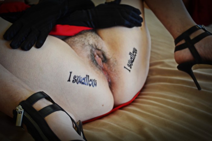 Naked mature with inscriptions on the body